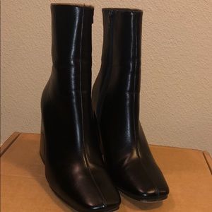 I am selling these nastygal Flare Heeled Booties